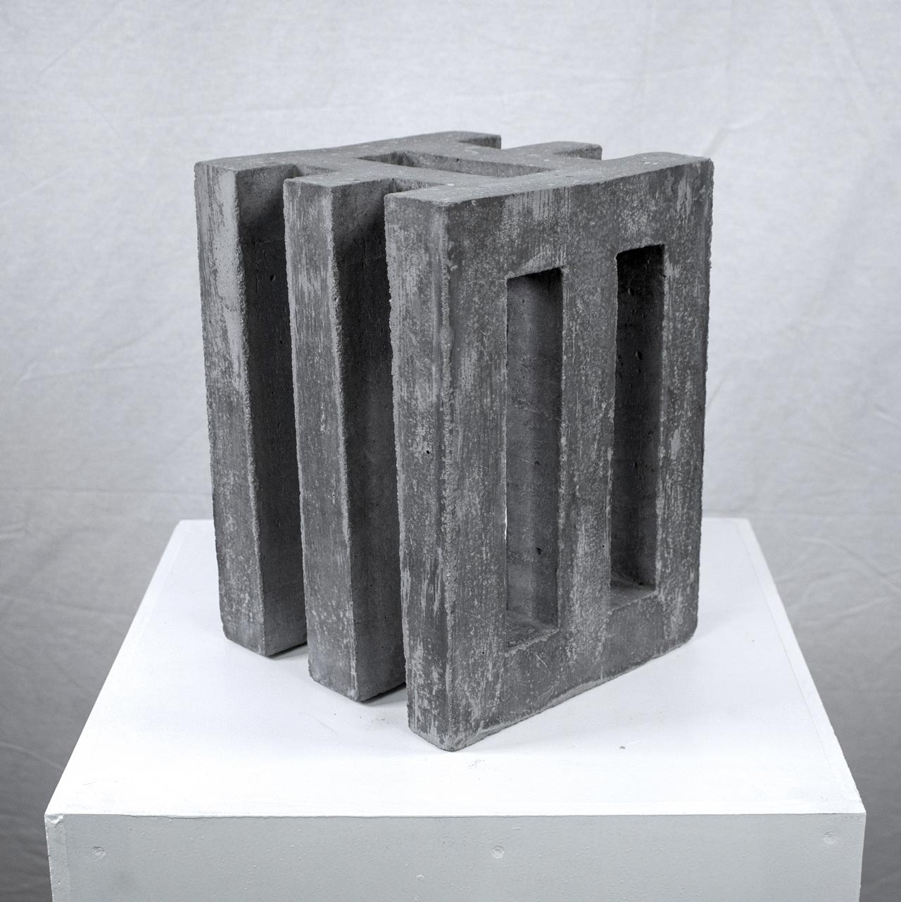 Photograph of geometric sculpture made of concrete